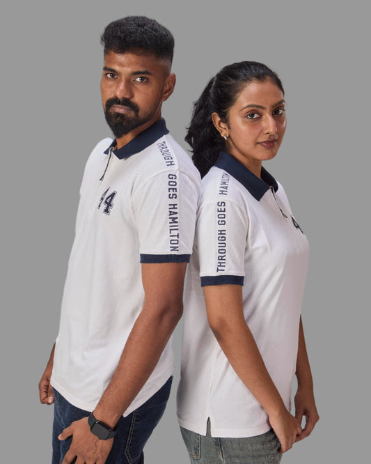 Two people wearing matching white polo shirts with through goes hamilton written on the sleeves and 44 in the front  on a plain background