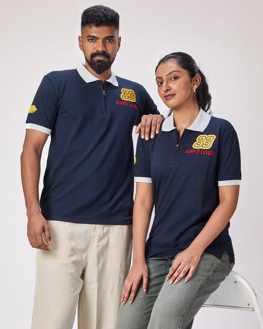 Two people wearing navy blue polo shirts with 33 and simply lovely embroidered on the front and a bull on the side on a white background
