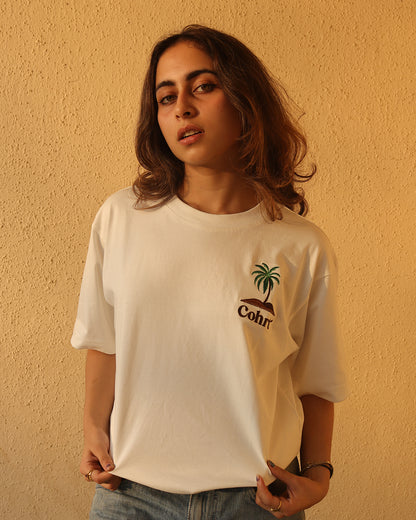 Woman standing Wearing white t-shirt and Palm tree on the pocket side 