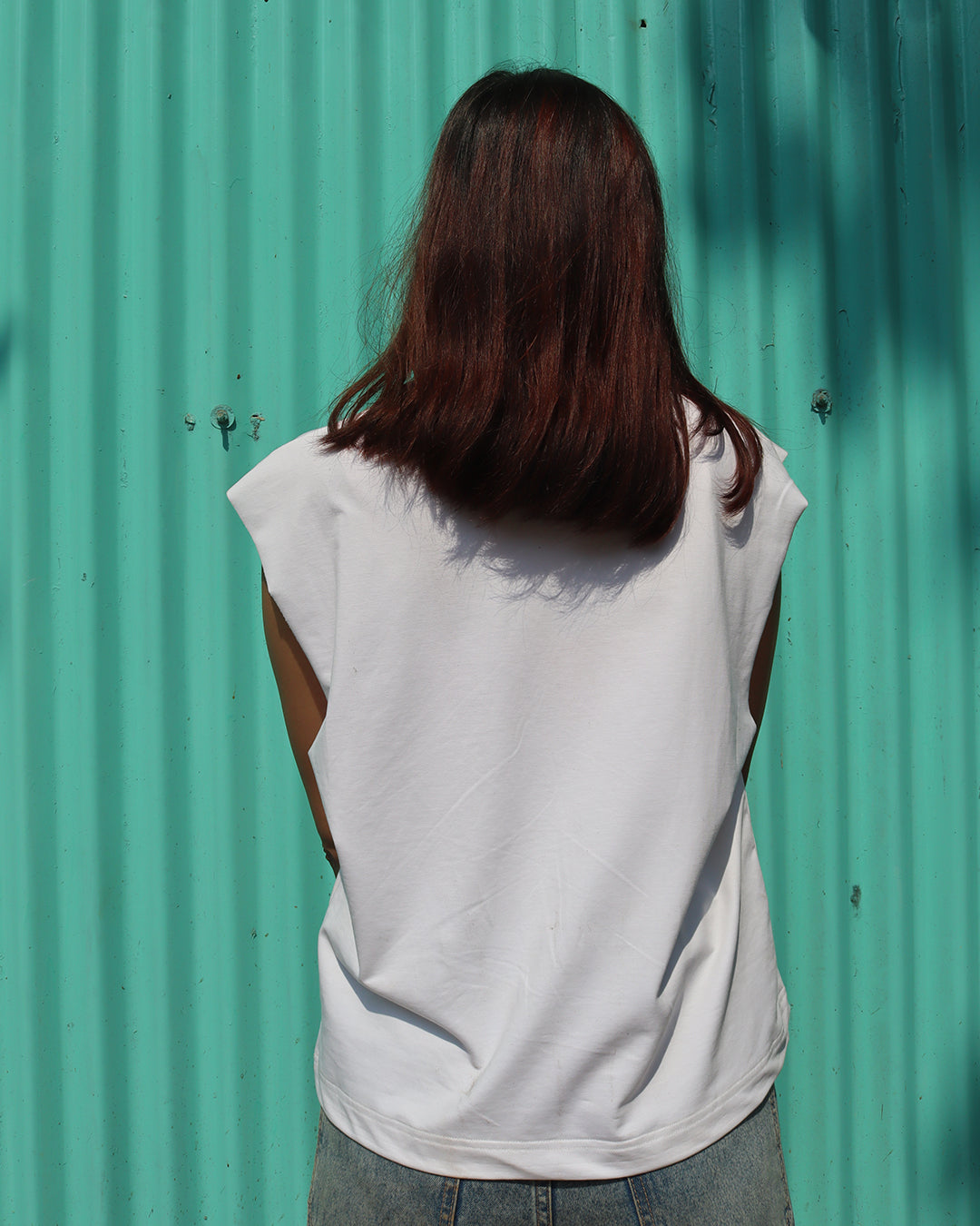 woman wearing white tank top