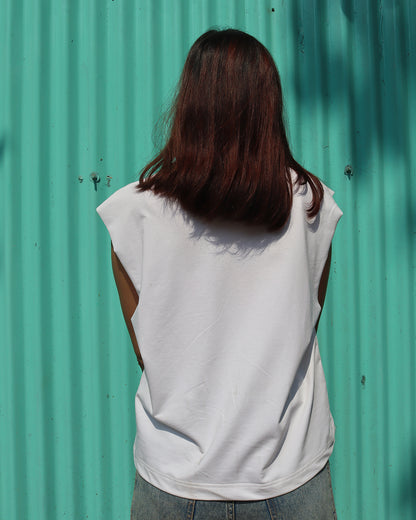 woman wearing white tank top