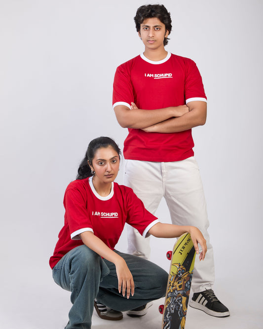 Two people wearing red t-shirts with white text on a plain background